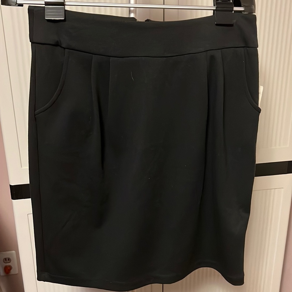 Ladies size 8 brand new black skirt with tags.